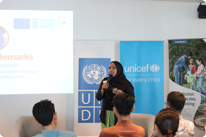 EU-YELL COP28 Youth Aspirations Dialogue Organising Committee Lead and UNICEF Youth Climate Champion, Nurfatin Hamzah presenting the opening remarks.